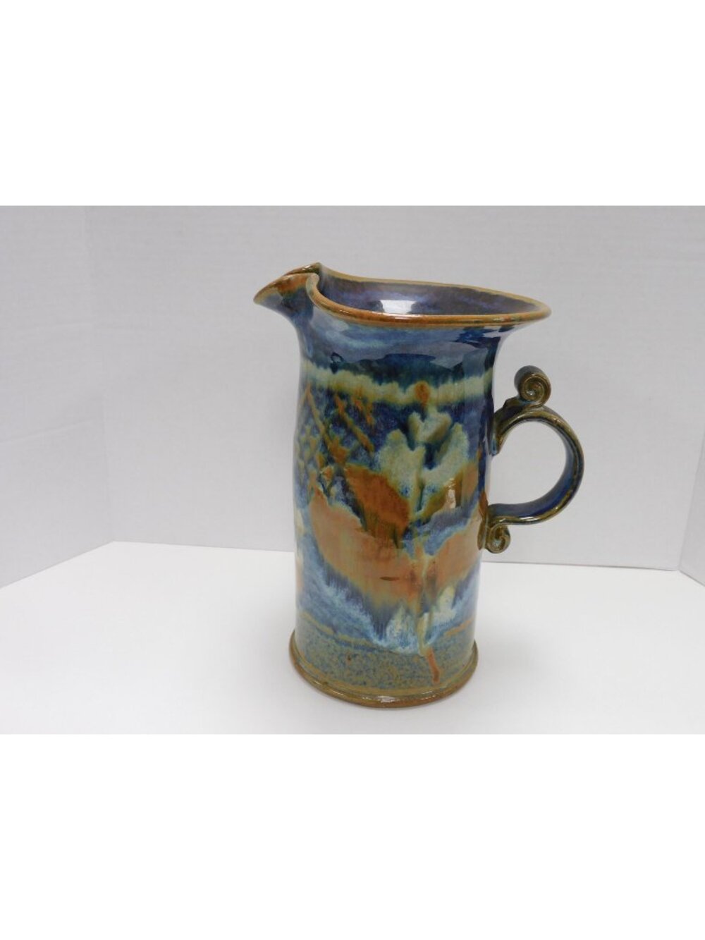 Ruffled Rim Art Pottery Blue And Earth Tone Colors Pitcher W/Lid 9" JC15